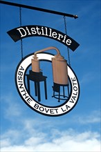 Hanging sign of the absinthe distillery Bovet La Valote