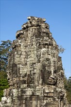 Tower with a face carved in stone