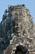 One of the more than 50 mystical towers of Bayon Temple with huge carved stone faces