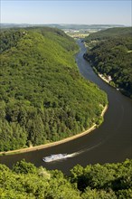 Excursion boat cruising on one arm of the big loop of the Saar river near Mettlach