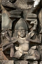 Bas-relief depicting a woman with a triangular Bayon-style headdress