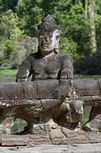Asura statue bearing the giant snake Naga