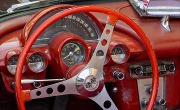Red steering wheel with dashboard