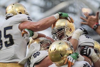 Notre Dame players celebrate a touchdown during the NCAA football game between the Navy and the Notre Dame on September 1