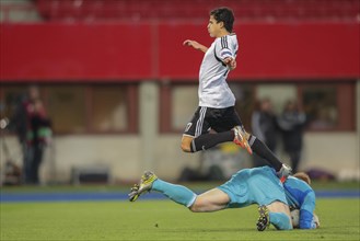Keeper Lukas Koenigshofer takes the ball away from Tarik Elyounoussi