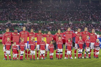 The Austrian team poses before the WC qualifier soccer game on October 16