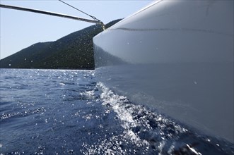 The hull of a catamaran floating on the water