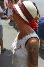 Woman wearing a Panama hat and a summer dress
