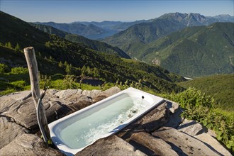 Alpe Nimi Mountain with a bathtub with a view towards the Alps