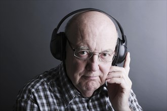 Senior wearing headphones