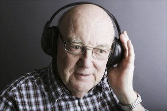Senior wearing headphones