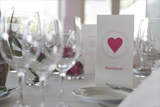 Table decorations and menu cards at a wedding reception