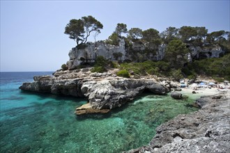 Beach in the rock-lined bay of Calo des Moro