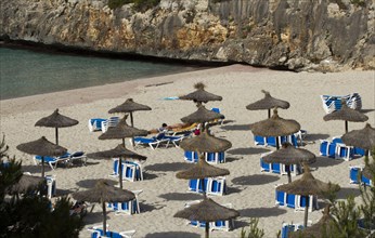 Parasols and sun loungers on the beach