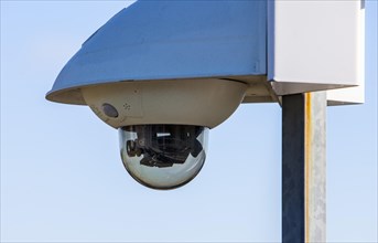 Surveillance camera in front of a building