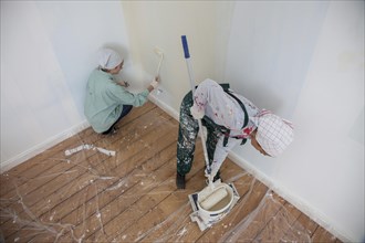 Mother and daughter renovating a room