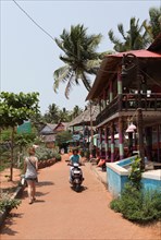 Restaurants and shops under palm trees