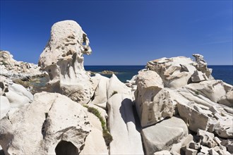 Eroded granite rocks on the beach of Punta Molentis