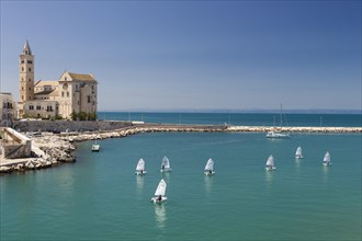 Sailing school in the harbor with Trani Cathedral