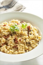 Cous cous with sundried tomatoes and mushrooms