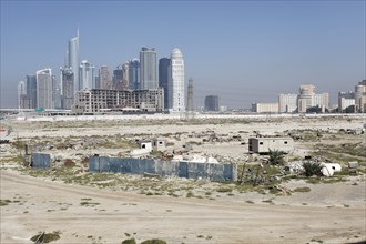 Barren land with high-rise buildings