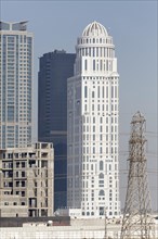 Skyscrapers and a discontinued construction site with the building shell