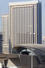 Jumeirah Lake Towers Metro Station in front of a skyscraper