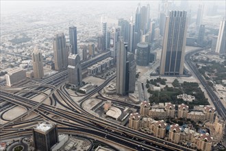 View from Burj Khalifa over a motorway junction and Dubai International Financial Centre