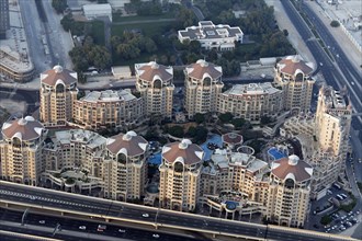 View from Burj Khalifa over a residential complex with luxury apartments and pool areas