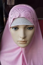 Mannequin wearing a fashionable Arab headscarf
