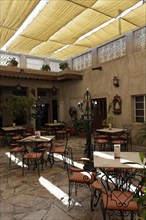 Restaurant in an inner courtyard with an awning