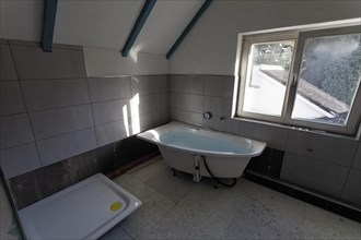 Old bathroom with new shower base and tub