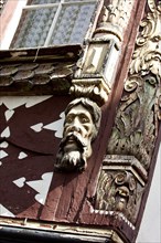 Historic half-timbered building with wall decorations at Burggraben