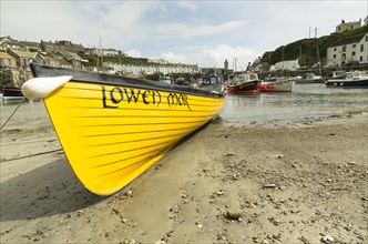 Rowing boat in the harbour of Porthleven at low tide