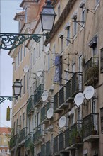 Typical facades with balconies and satellite dishes