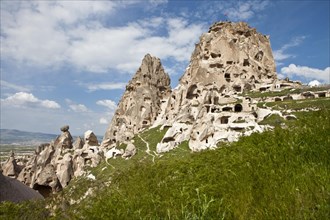 Fortress of Uchisar surrounded by Fairy Chimneys made of tufa
