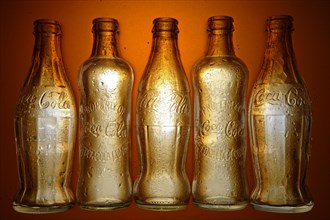 Various historic Coca-Cola bottles