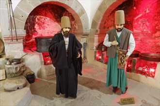 Life-size figures of dervishes in the bazaar