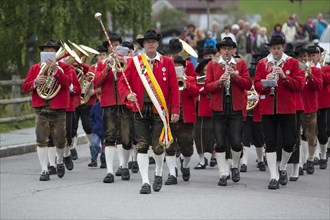 The Weissensee marching band in traditional costumes performing at the Naturparkfest festival in Techendorf