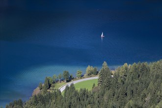 View over the deep blue and clear waters of Weissensee lake
