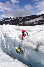 Climbers on Zufallferner glacier at a crevasse rescue