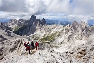 Climbers climbing Kesselkogel mountain via the fixed rope route above the Grasleitenpass