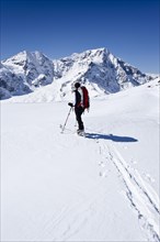 Backcountry skier climbing Schoentaufspitze mountain