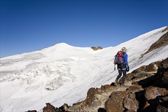 Hiker walking on the summit ridge