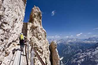 Hiker climbing Monte Cristallino mountain