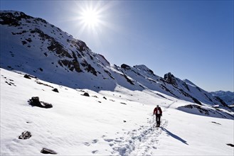 Mountain climber ascending Wilde Kreuzspitze Mountain in the Pfunderer Mountains