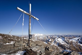Summit cross on the summit of Wilden Kreuzspitze Mountain in the Pfunderer Mountains