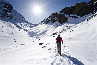 Mountain climber descending from Wilde Kreuzspitze Mountain in the Pfunderer Mountains