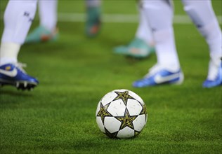 Real Madrid players running after the official match ball