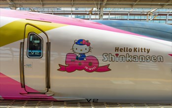 Hello Kitty advertising on high speed train Shinkansen on platform